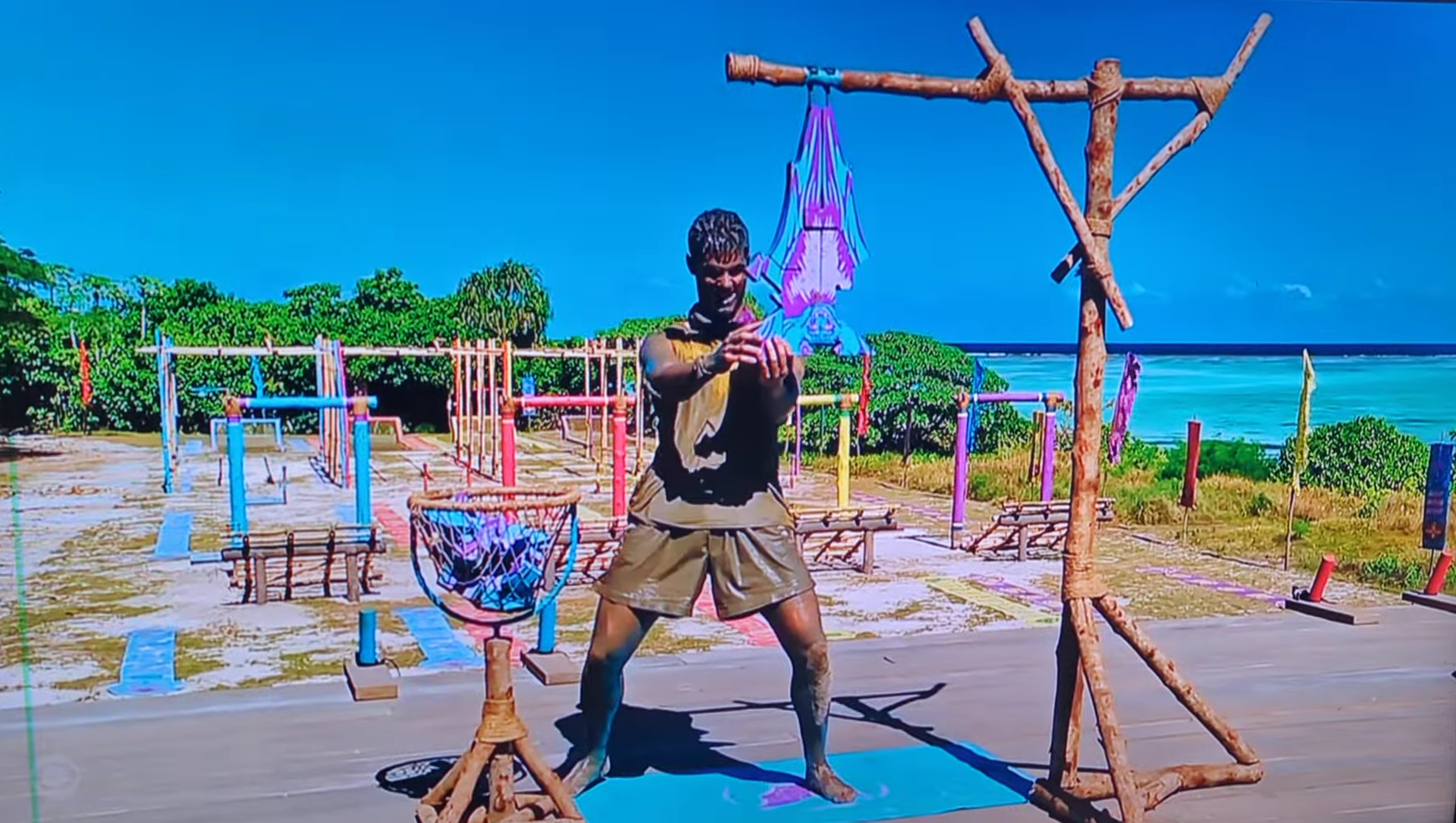 A beach at sunset with vibrant colors and calm waves.