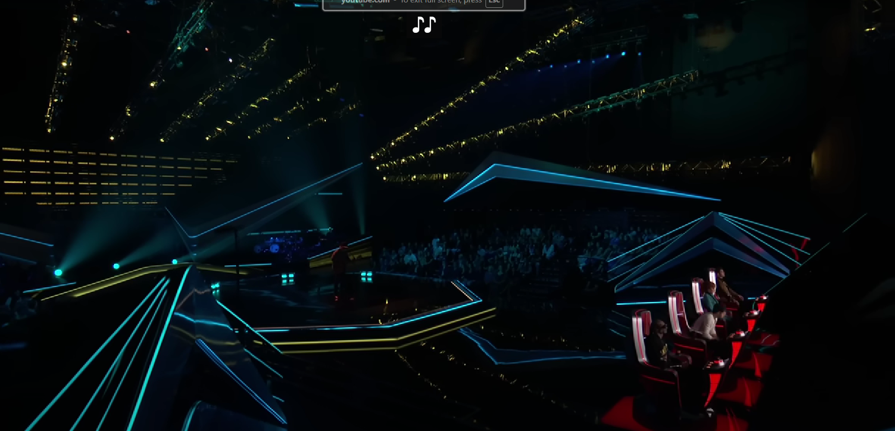 A beach at sunset with vibrant colors and calm waves.