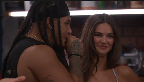 A beach at sunset with vibrant colors and calm waves.