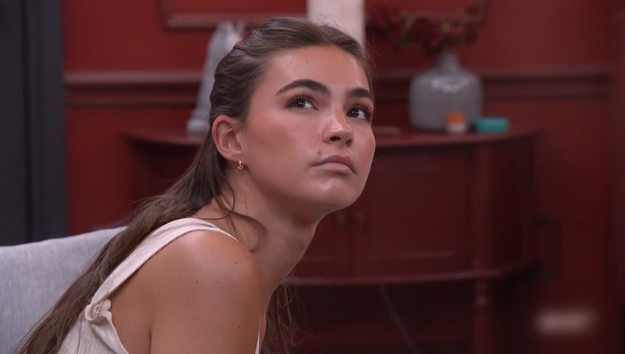 A beach at sunset with vibrant colors and calm waves.